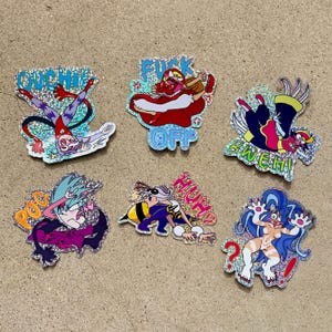 May include: A collection of six holographic stickers featuring cartoon characters in various poses. Each sticker has a unique design with vibrant colors and text, including phrases like "OUCHIE" and "FUCK OFF."