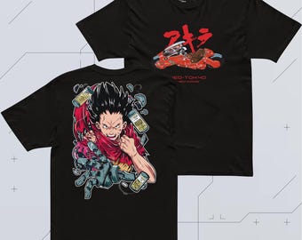 May include: A black short-sleeve t-shirt featuring a red motorcycle graphic and Japanese text on the front. The back displays a detailed illustration of a character with a mechanical arm, surrounded by floating canisters and red fabric accents.
