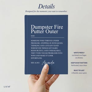 May include: A navy blue notebook with white text reading Dumpster Fire Putter Outer, a definition of the noun, and the name Amanda. The notebook features 150 ruled pages, 75 sheets, a flexible sewn spine, and measures 5.75 inches by 8 inches.
