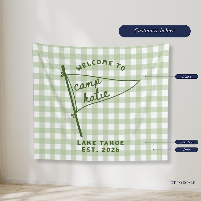 May include: A light green and white gingham patterned wall tapestry featuring a dark green pennant graphic with the text "WELCOME TO camp katie" and "LAKE TAHOE EST. 2026" printed below. The design includes labels for customization: Line 1, Location, and Date.