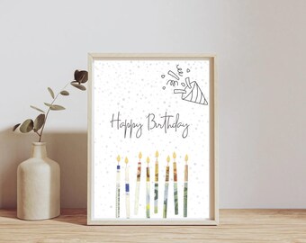 May include: A white card with the words "Happy Birthday" and a party hat with confetti. There are nine candles made of money bills.