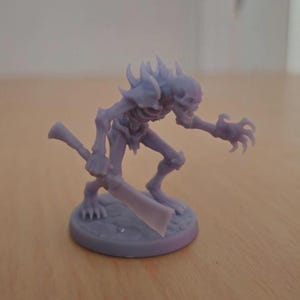 May include: A light purple miniature figurine of a skeletal creature with a sword. The figurine has a detailed design, including a skull-like head, sharp claws, and a rib cage. The figure is standing on a circular base.
