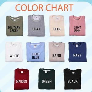 Op de afbeelding: Een kleurenkaart met verschillende sweatshirts in verschillende kleuren. De kleuren zijn onder meer legergroen, grijs, beige, lichtroze, wit, lichtblauw, zand, marine, bordeauxrood, groen en zwart. De tekst "COLOR CHART" staat bovenaan.