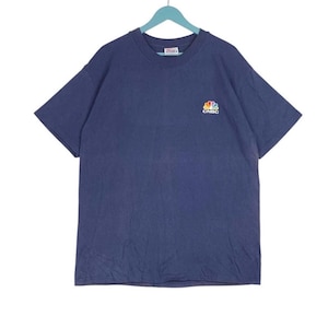 May include: A vintage navy blue t-shirt with a small embroidered CNBC logo featuring a rainbow peacock design.