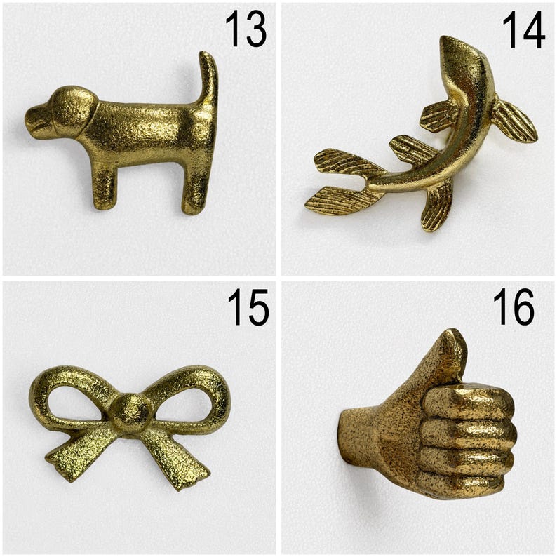 May include: A set of four brass-toned metal wall hooks featuring distinct shapes: a dog silhouette labelled 13, a fish shape labelled 14, a decorative bow labelled 15, and a hand making a thumbs-up gesture labelled 16, all with a textured finish.