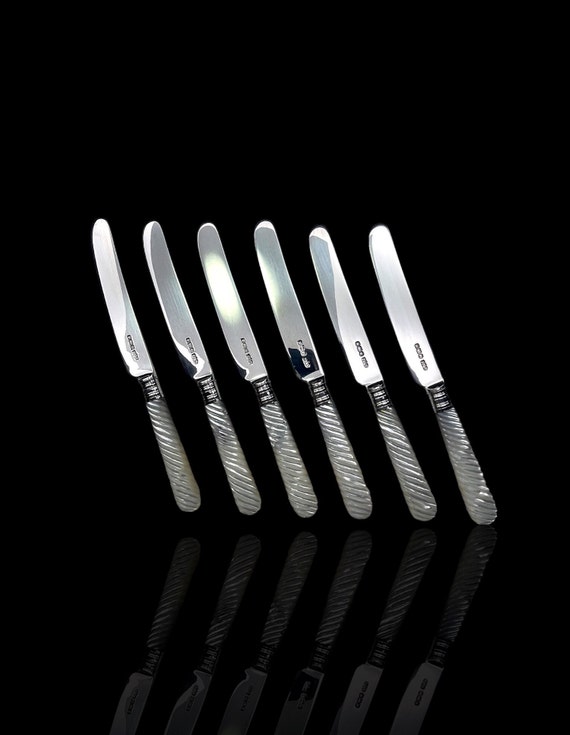 Museum quality mother of pearl and silver butter knives. Dated 1917. Made by famed english silversmiths James Dixon & Sons. With Case.