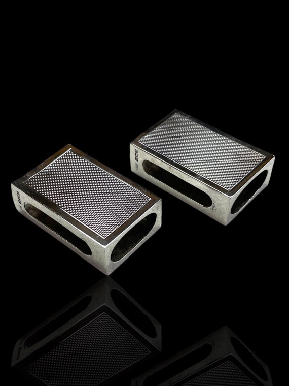 A fine and rare pair of English sterling silver match box cases. Made in 1938 by Silversmith G Bryan & Co.