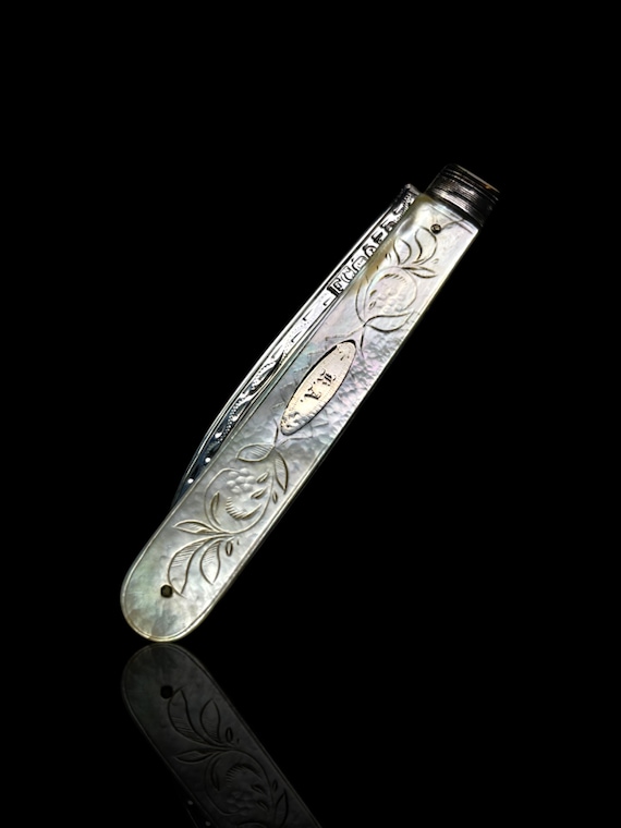 A Victorian sterling silver and mother of pearl folding pocket knife. English.