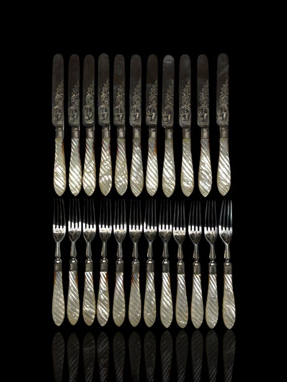 An exceptional Victorian era mother of pearl and silver plate 24 piece cutlery set. Cased.