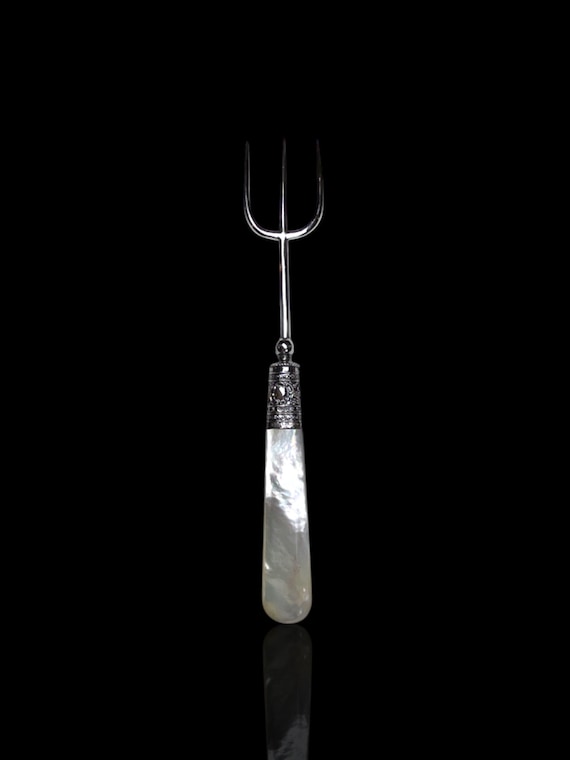 A vintage sterling silver and mother of pearl fork. Made in 1921 by English silversmith Francis Howard Ltd.
