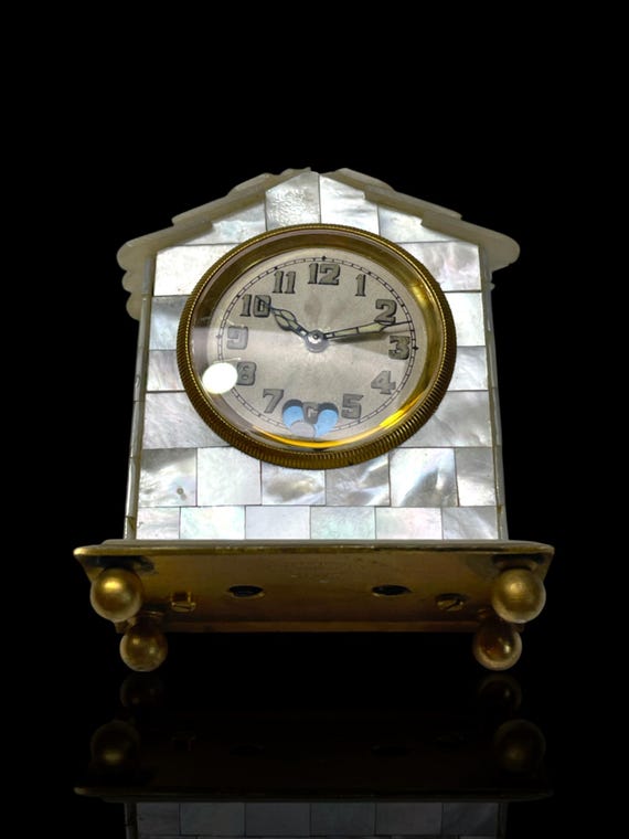 A rare Swiss made mother of pearl clock by Solomax Watch Company. Excellent working condition. Circa 1910.