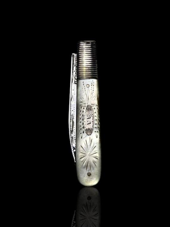 Antique Victorian sterling silver and mother of pearl folding pocket knife.