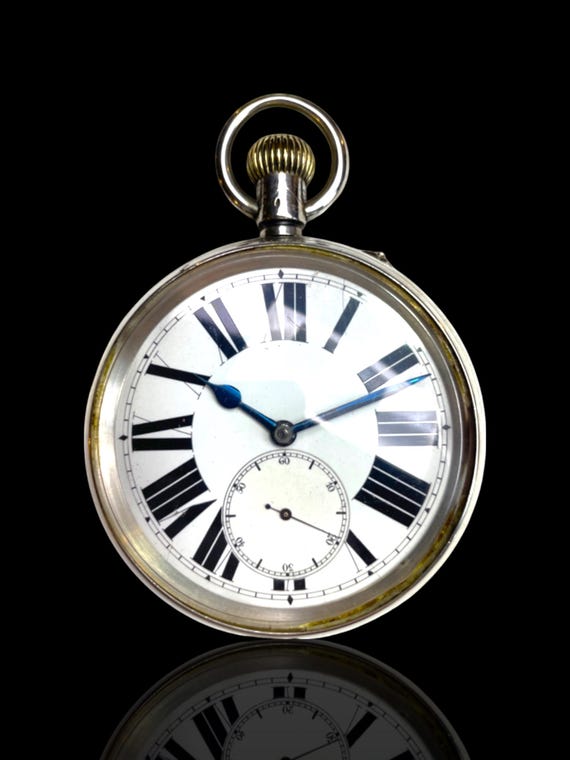 A sterling silver and rare Goliath sized Swiss hallmarked pocket watch. Excellent working condition. With stand.
