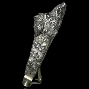 An exceptional silver plate cigar cutter in the shape of a boar head.