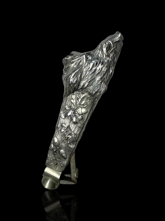 An exceptional silver plate cigar cutter in the shape of a boar head.