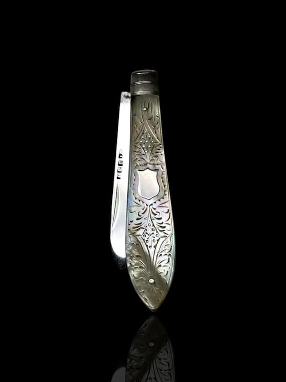 A fine Victorian era mother of pearl and sterling silver folding pocket knife. Made in 1885, England. With Presentation Case.
