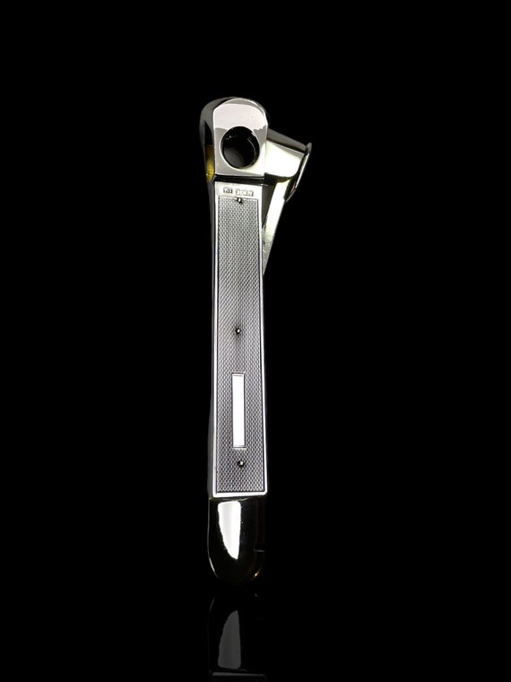 A large English sterling silver cigar cutter by SJ Rose. Dated 1967.