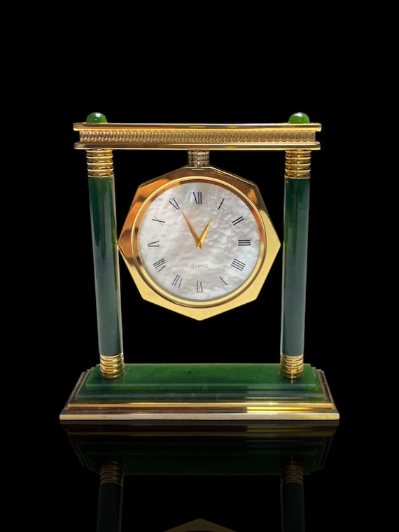 A large Art Deco style mother of pearl, jade and gold plate desk clock. Quartz movement. Good working order.