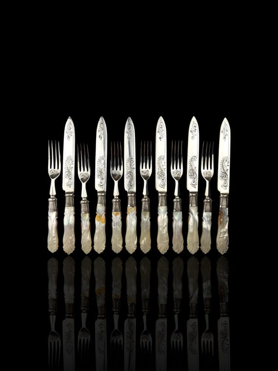 Cutlery Set. Mother of Pearl and Silver Plate. Circa 1900.