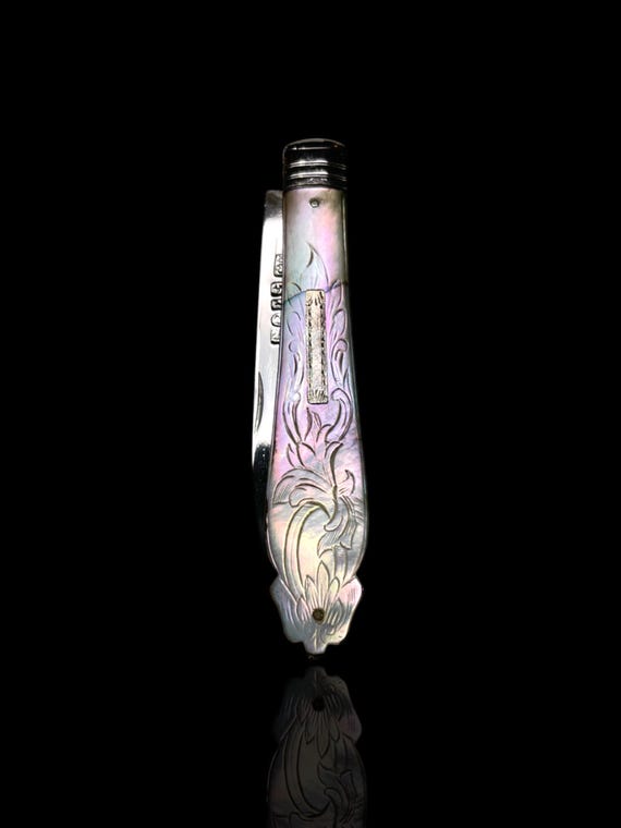 A vintage silver and mother of pearl folding pocket knife. Made in 1903 by William Needham. England.