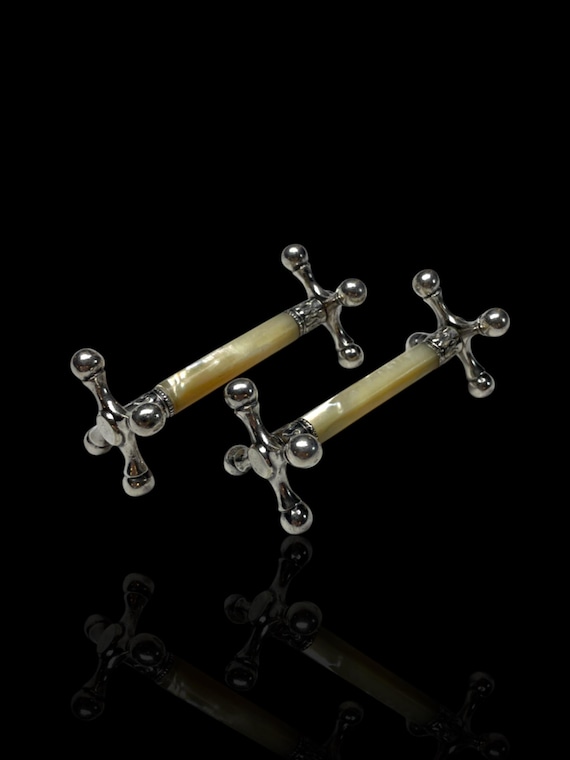 An Antique Pair of Mother of Pearl Knife Rests. With Presentation Case.