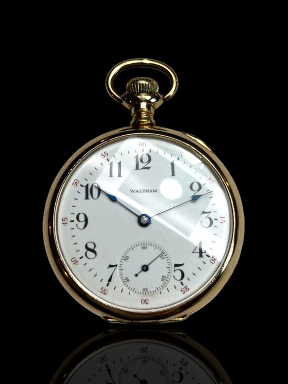 A very fine gold plate Waltham pocket watch. Includes stand to allow the piece to be presented as a desk clock.