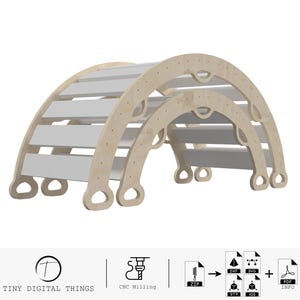 May include: A set of two wooden archways, one smaller than the other, with a white painted finish. The arches are designed for children to climb over and under. The arches are made of plywood and have rounded edges for safety. The arches are designed for indoor or outdoor use.