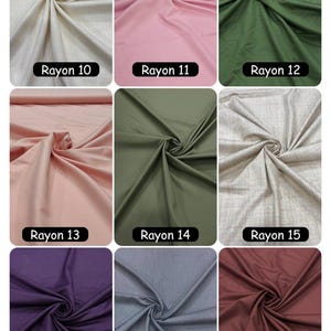 May include: A grid of nine fabric swatches labeled Rayon 10 through Rayon 18, featuring various solid colors including cream, pink, olive green, light pink, dark olive, textured beige, deep purple, slate gray, and maroon, all with draped folds.