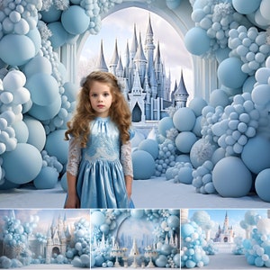 May include: A young girl in a blue dress stands in front of a backdrop of blue balloons and a castle. The castle is made of white stone and has many towers. The balloons are arranged in a cluster around the girl and the castle.