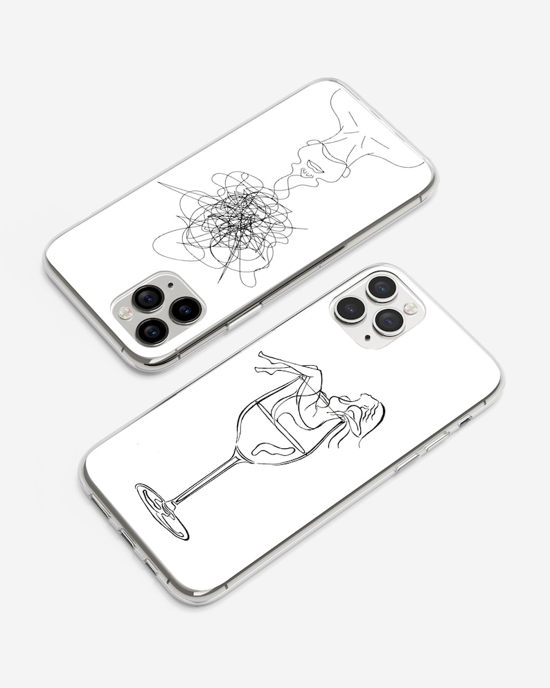 May include: Two clear phone cases with black line drawings. One case features a woman's face with lines extending from her head. The other case features a woman's body inside a wine glass.