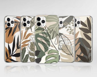 May include: Four phone cases with a tropical leaf design. The cases are clear and show a white background with brown, green, and black leaves.