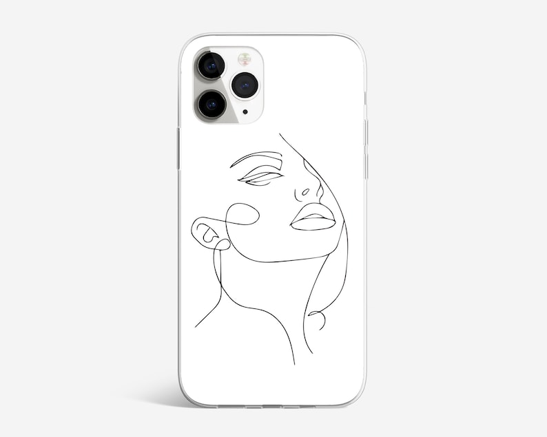 May include: A white phone case with a black line drawing of a woman's face. The woman's eyes are closed and her mouth is open.