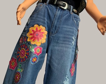 Upcycled Distressed Barrel Jean with Floral Design and Hardware.