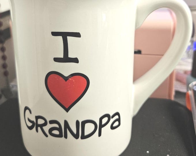I love the Grampa Coffee Mug with green interior. Our name is Mud " Lorrie Vessey" Artist B6/17