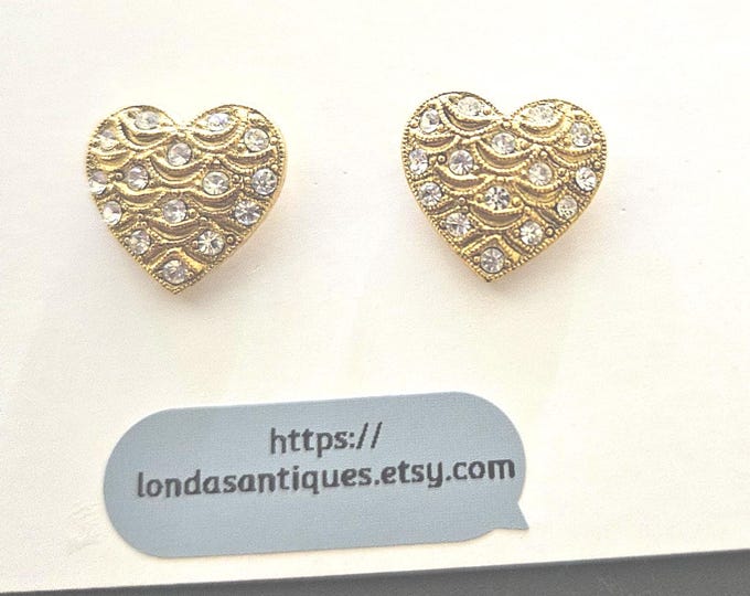 Beautiful set of earrings featuring gold hearts adorned with diamond-like stones, designed for pierced ears. (Box)
