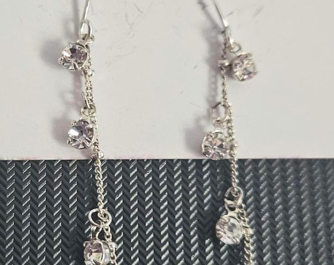 Michael Gabriel's diamond fleur-de-lis drop earrings.