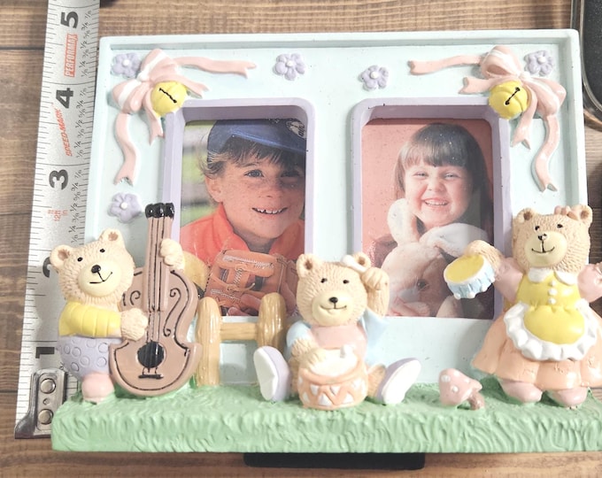 Three vintage baby bears are in a photo frame; they are playing in a bear band: one on the bass, drums, and ambourine.F6/12