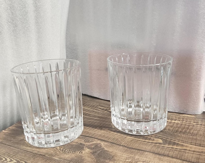Vintage set of two vodka rocks glasses featuring embossed "Stoli" on the bottom F6/8