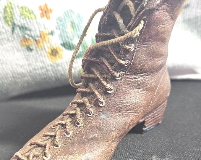 Vintage Victorian lace-up work boot figurine, slightly tilted to one side. C7/20