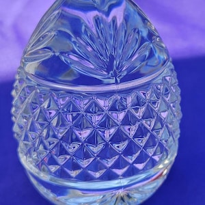 This crystal egg paperweight is from France and was made in 1993. A4/6