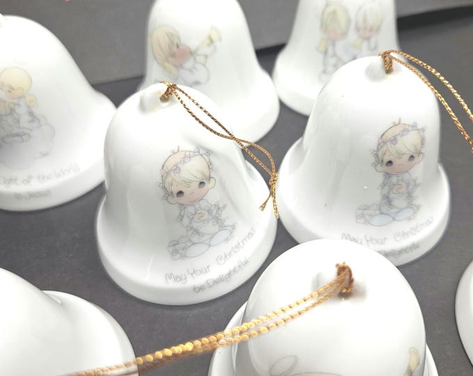 Vintage set of 8 Precious Moments Christmas bells from the 1980s.
