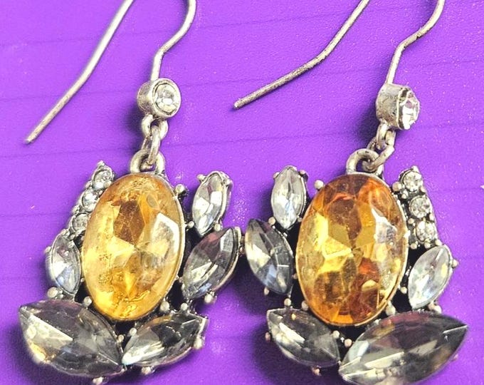 Vintage silver earrings featuring citrine along with dark and clear stone embellishments.
