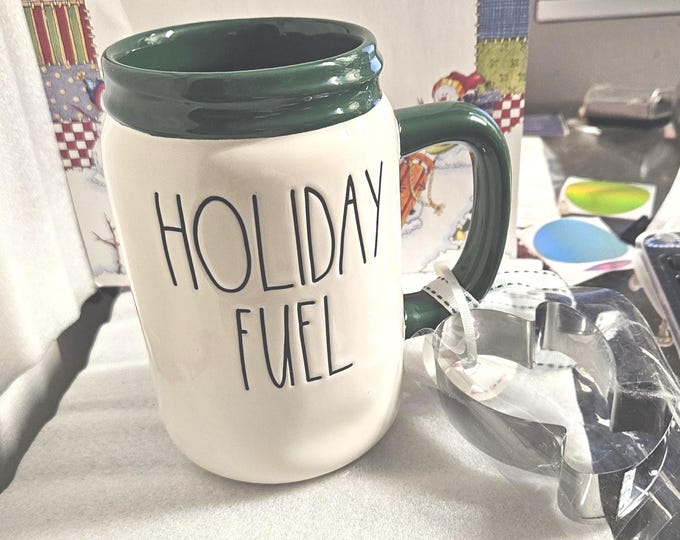 Rae Dunn Holiday Fuel Mug with an attached cookie cutter. RD2/7