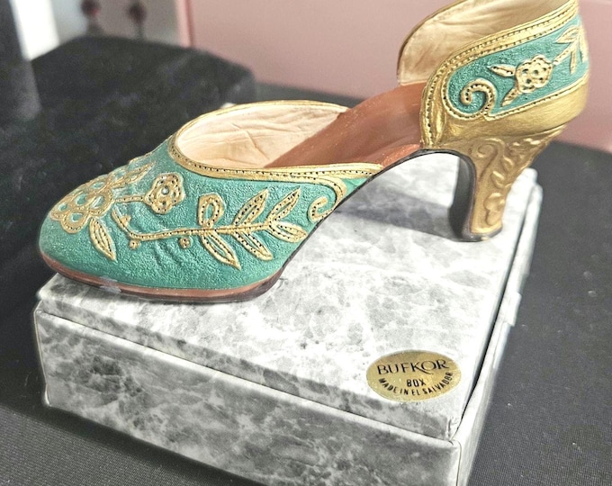 Just the right shoe: "Carved Heel," 1999. Miniature green shoe #25096. C6/14