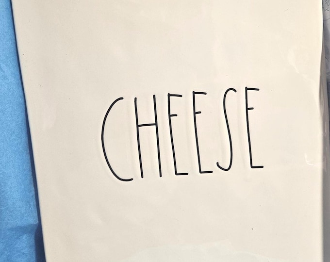 Rae Dunn cheese board featuring the word "CHEESE". (RD)7
