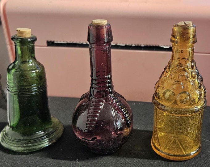 Set of 3 bitters bottles with corks: Ball and claw,  Amber Grapes,  and Liberty bell C6/12
