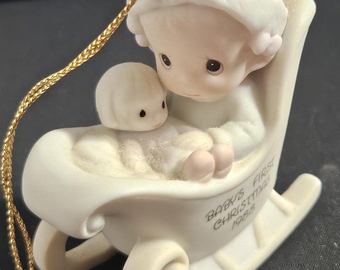 1989 Precious Moments Baby's First Christmas ornament, a baby girl in a sled holding her baby, Pm 523208 Box 4/19
