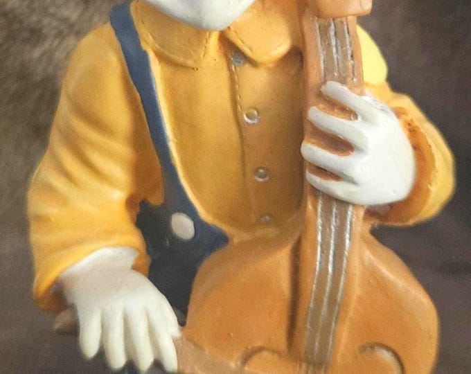 Vintage Clown figurine playing the CHELLO in a blue and yellow suit G3620 D5/10