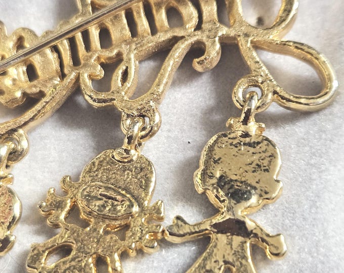 Vintage Gold Grandma Lapel Pin with Three Hanging Children: Two Boys and a Girl. (closet)
