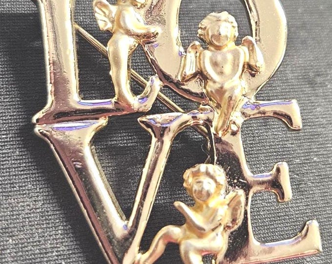 Religious love angel brooch with a gold tone. (BOX)